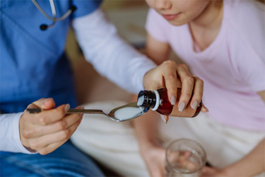 GettyImages-1480549690-nurse-giving-medicine-to-children GettyImages-1480549690-nurse-giving-medicine-to-children